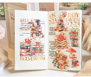 Detail of vintage watercolor book stickers with rabbit and mushroom motifs on a journal page