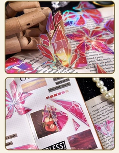 Macro detail of translucent crystal PET stickers with holographic gold edges for journaling