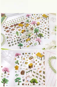 Detail showing scenery stickers with miniature houses and cherry blossom trees