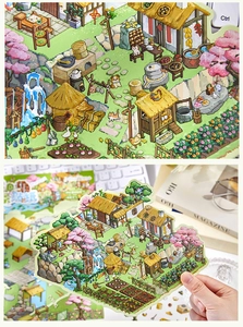 Macro detail of pixel art scenery stickers featuring traditional rural farm and cherry trees