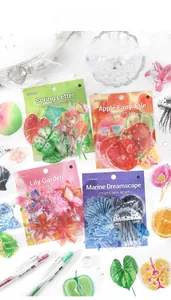 Flat lay of four translucent PET sticker packs featuring floral and ocean themes