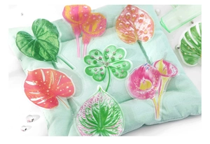 Macro shot of tropical leaf PET stickers including monstera and clover for DIY journals