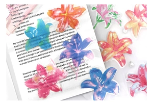 Close-up of decorative lily PET stickers with floral motifs for DIY journals and crafts