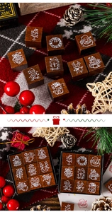 Macro shot of 9 Christmas wooden stamps featuring Santa and reindeer in a gift box