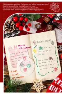 Detailed view of Christmas wooden stamp set with Santa and reindeer motifs for journaling