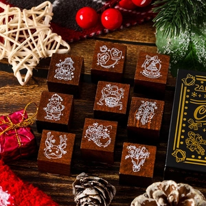 9-piece Christmas wooden stamp set featuring festive motifs like Santa and reindeer
