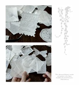 Detailed macro of 3D embossed floral stickers with vintage butterfly and stamp motifs