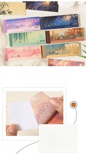 Macro detail of adhesive nature landscape stickers being peeled for scrapbook decorating
