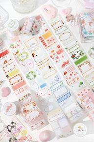 Detail of decorative washi tape with floral and cute animal patterns for DIY journaling