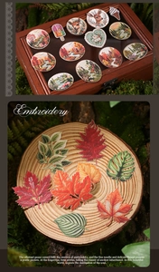 Macro detail of forest-themed embroidered patches with woodland motifs on wood
