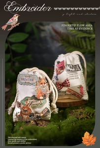 Detail of vintage canvas drawstring bags with animal embroidery and pearl accents