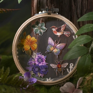 Nature embroidery patch set with floral and butterfly motifs on a wooden hoop frame
