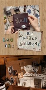Macro detail of retro letter stickers and vintage paper collage on a leather journal