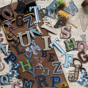 Vintage alphabet embroidery patches set with floral and denim textures for craft decoration