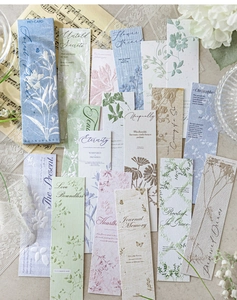Detailed macro of vintage forest themed bookmarks with floral patterns and embossed texture