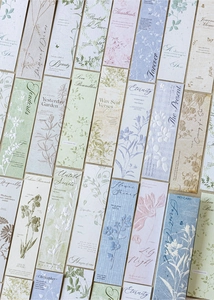 Detail of floral embossed bookmarks in Morandi tones with textured paper finish