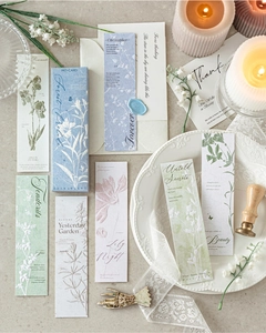 Artistic layout of floral bookmarks with relief textures in a blue gift box packaging