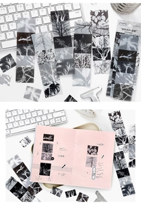 Detail of vintage nature PET stickers featuring forest silhouettes for journal decoration