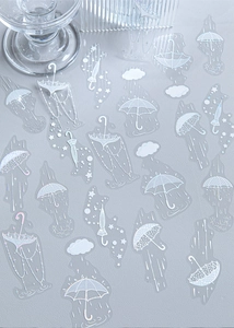 Macro view of PET laser silver stickers with dreamy white umbrella and cloud patterns