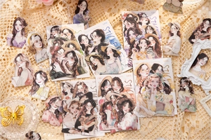 Detailed view of vintage girl illustration stickers on lace background for DIY journaling