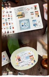 Detail of vintage daily life stickers with coffee motifs on a dark wooden background