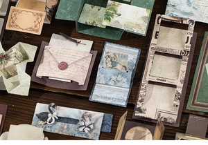 Detail of vintage scrapbooking paper with retro Parisian motifs and artistic cutouts