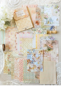 Flat lay of retro floral scrapbook paper set with vintage botanical and music note motifs