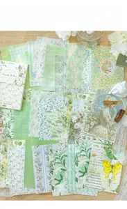 Flat lay of retro Camellia Is Green decorative scrapbooking paper with floral patterns