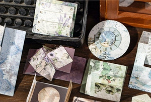 Macro view of vintage-style paper craft materials and French script ephemera