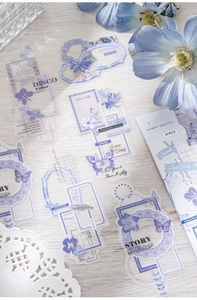 Detailed view of floral PET stickers with lavender and blue lace designs for DIY journals