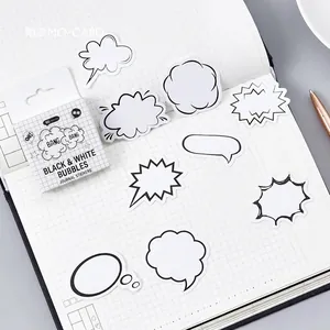 Zwart-wit tekstballon stickers voor DIY-journaling op een geruit notitieboekje