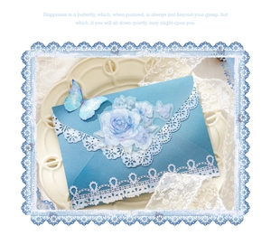 Detail of blue floral lace stickers with butterfly motifs for DIY journaling
