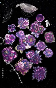 Detailed view of floral PET stickers with shimmering laser effect on dark background