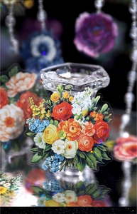 Macro detail of transparent multi-color floral PET stickers on a glass candle holder