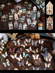 Detailed view of vintage European building and butterfly stickers for DIY scrapbooking