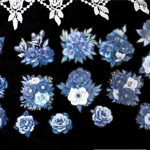 Holographic PET blue floral stickers with various flower shapes on dark background