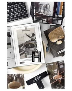 Flatlay of vintage scrapbooking set with 50 pieces of decorative cards and metal clips