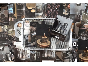 Detail of coffee themed decorative scrapbook cards in a white wire storage basket