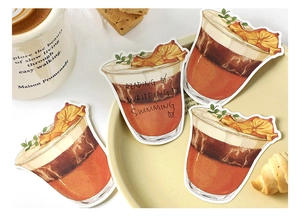 Detail of coffee-themed stationery stickers featuring illustrated iced lattes and check-lists