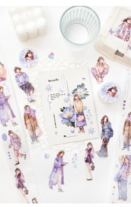 Close-up of winter girl theme washi tape and stickers for creative journaling decor