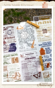 Macro shot of vintage manuscript transfer stickers with nostalgic butterfly and ink motifs