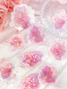 Close-up of pink watercolor floral PET stickers with laser glitter and romantic phrases
