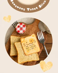 Creative cat-shaped toast sticky notes with cute cartoon faces on a wooden breakfast tray