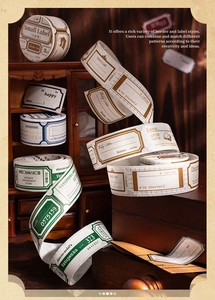 Macro shot of vintage style die-cut stickers featuring decorative frames and retro tickets