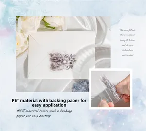 Macro detail of transparent PET floral stickers with vintage black and white flower patterns