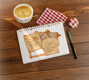 Detail of cute cat and dog toast sticky notes on a wooden desk in a cozy cafe setting