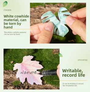 Macro detail of leaf-shaped white kraft stickers with writable surface and plant motifs