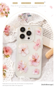 Detailed view of iPhone case with watercolor pink hibiscus and elegant gold line art