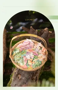 Macro shot of assorted watercolor leaf stickers including maple and ginkgo in a woven basket