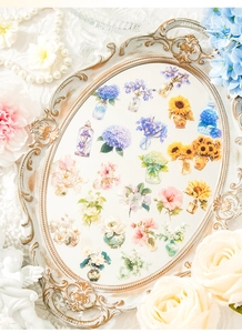 Detail view of floral stickers with watercolor hydrangeas on a vintage gold tray